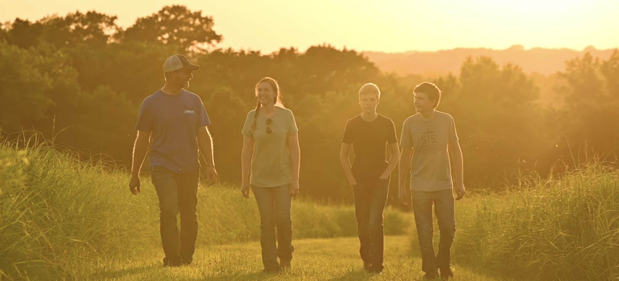 Chase Burns of LandGuys with his family in Western Illinois on their homestead property - Every Acre Tells a Story™